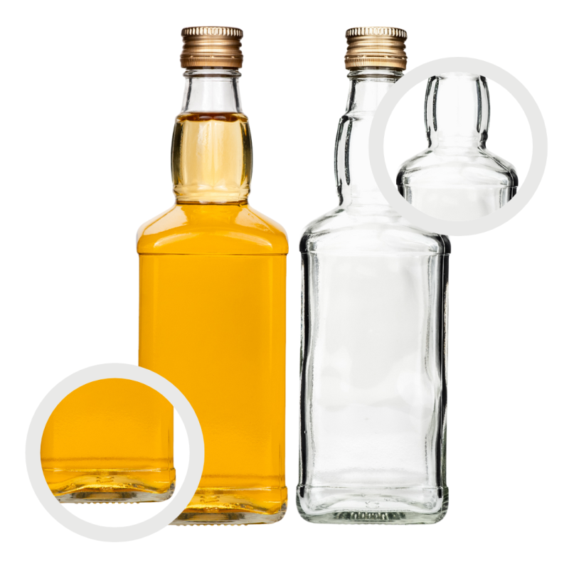 Kwadratowa szklana butelka Jack 500 ml z żółtą nalewką cytrynową i połówką cytryny obok, mocne grube szkło
